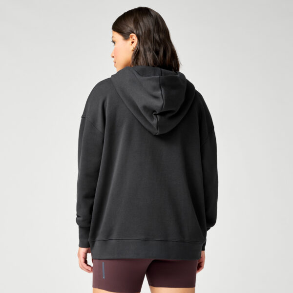 Brooks Reset Hoodie takaa – rento leikkaus ja mukava fleece-materiaali.